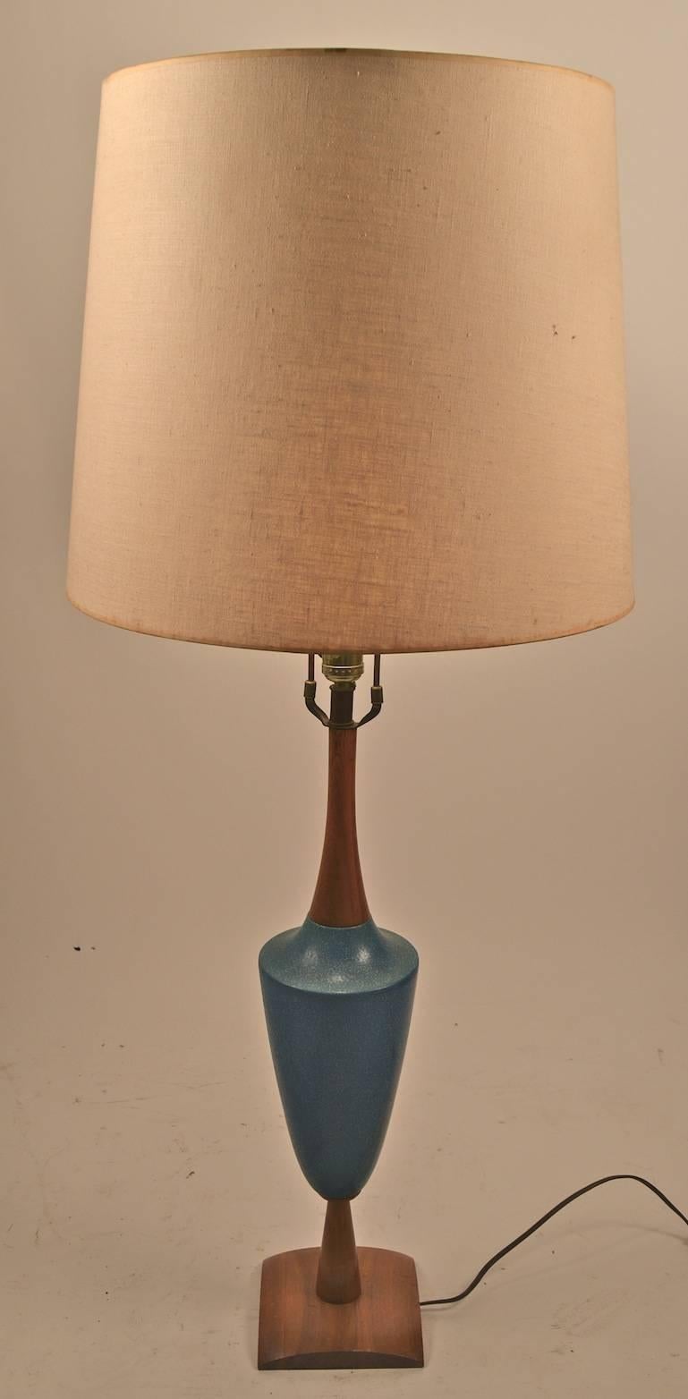 Architectural  form turquoise ceramic and teak, table lamp.  Design after Martz, American made, in the Danish manner. Working, original condition, shade not included.  28