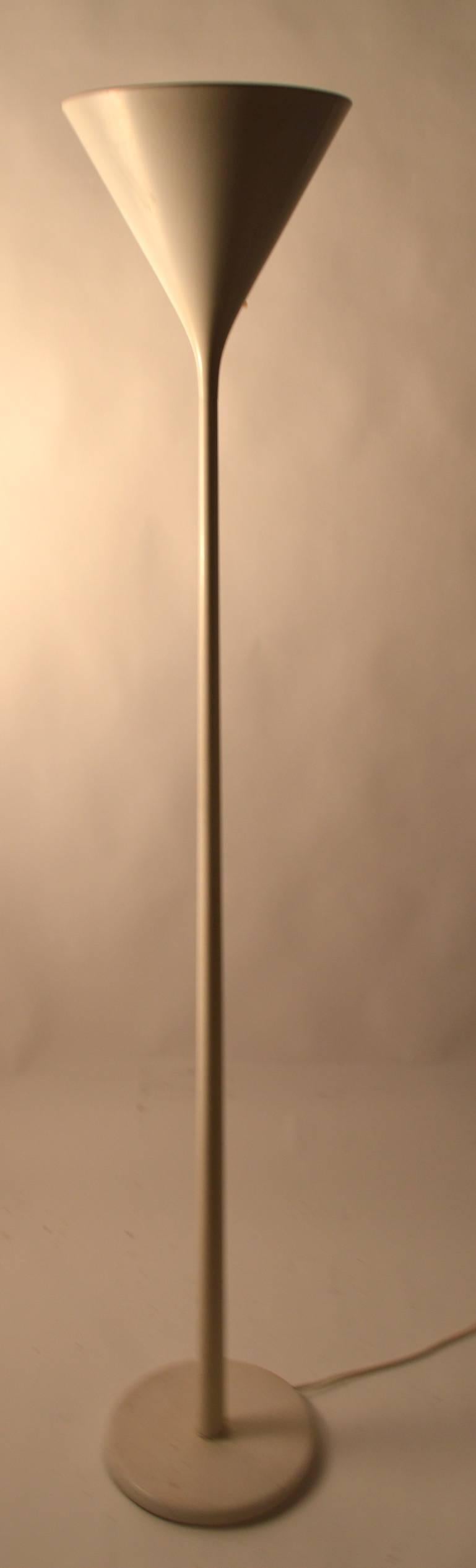 Modernist white enamel torchiere in the style of Max Bill.  This floor lamp takes the larger 