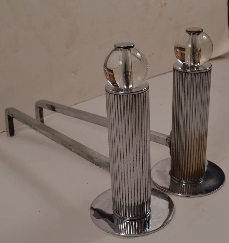 Diminutive Art Deco Andirons, AKA Chenetes. Machine Age design, fluted chrome column rests on chrome disk base, with glass ball top. Nice original condition, ready to use. 