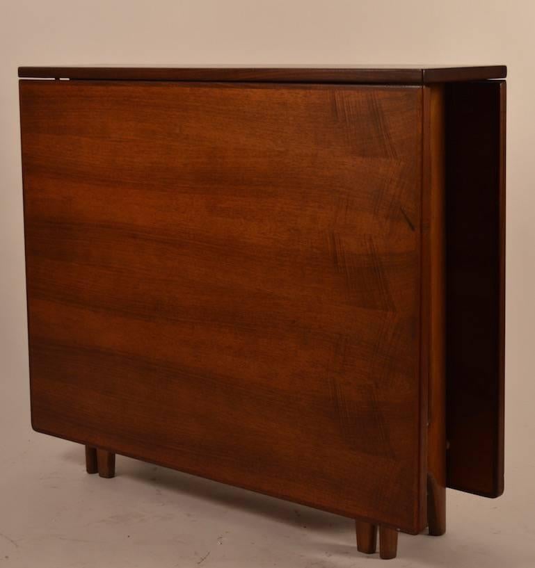 Nice Rosewood drop leaf table, after the classic Bruno Mathsson design . This example is in clean original condition, it does have a minor cigarette burn flaw on the surface ( pictured ) and minor cosmetic wear. The adjustable design makes this