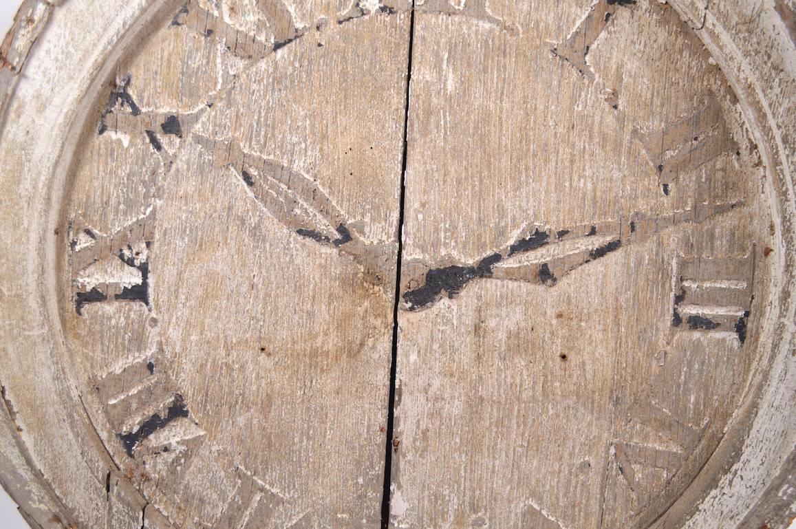 Interesting weathered wood clock face with painted hands. 
The back story is a local (Upstate NY) church was being built around the mid-19th century, when it came time to install the clock, the budget was gone, so this 