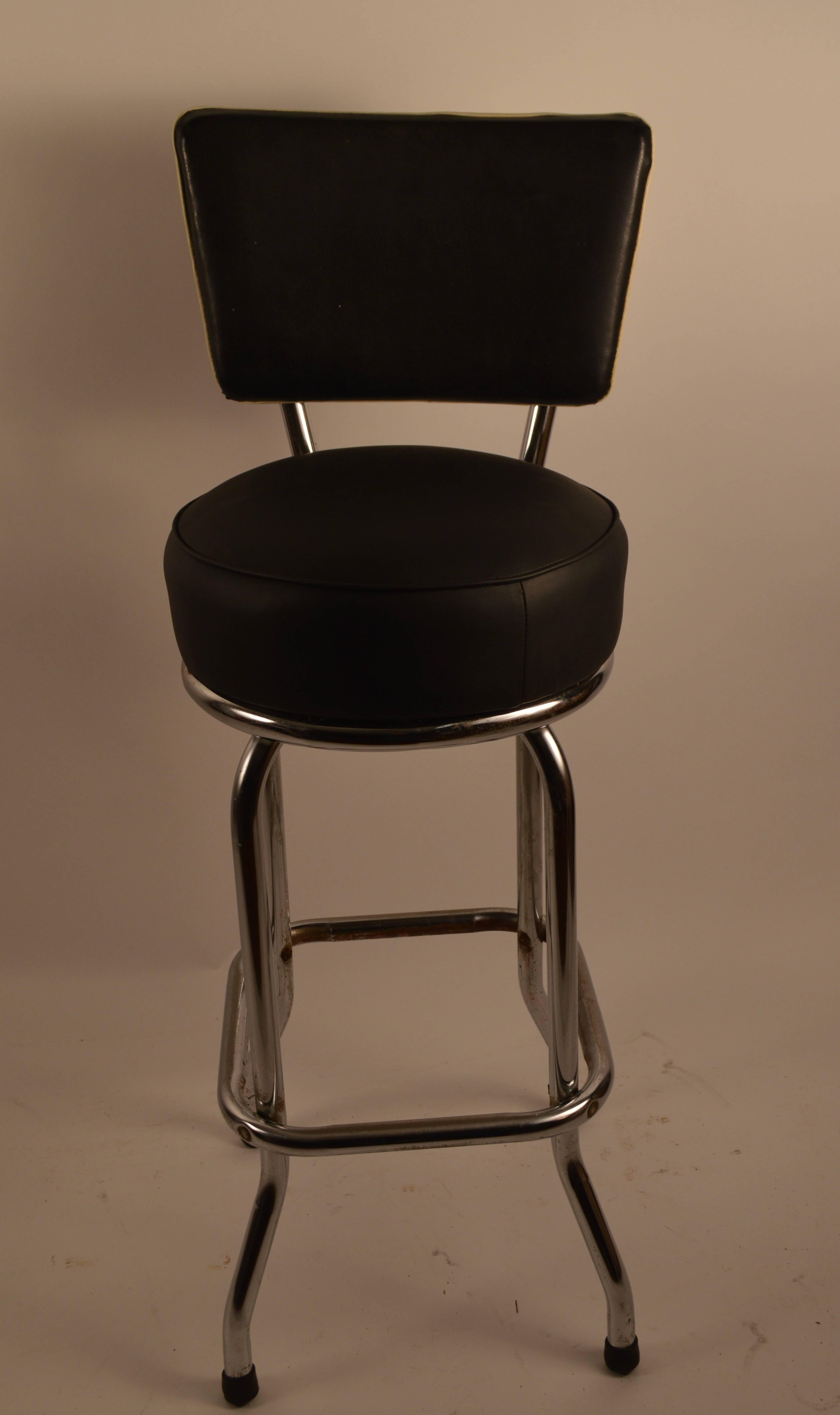 Hard to find the model, swivel stools with an upholstered back rest. Freshly upholstered seats, with original upholstery back rests. The chrome is in good condition, showing only very light surface rust, normal and consistent with age.