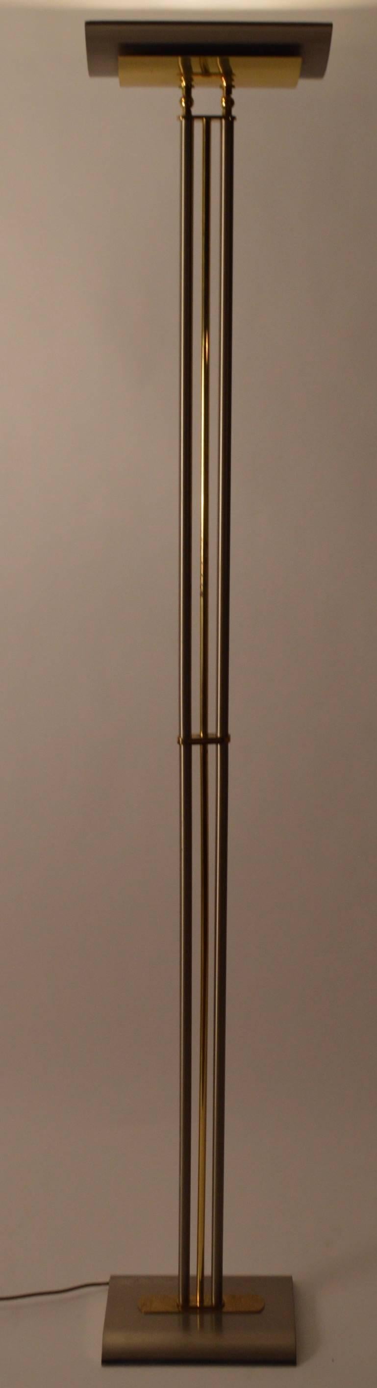 Postmodern Italian design torchiere floor lamp. Halogen light with tilt adjustable top. Manufactured by 