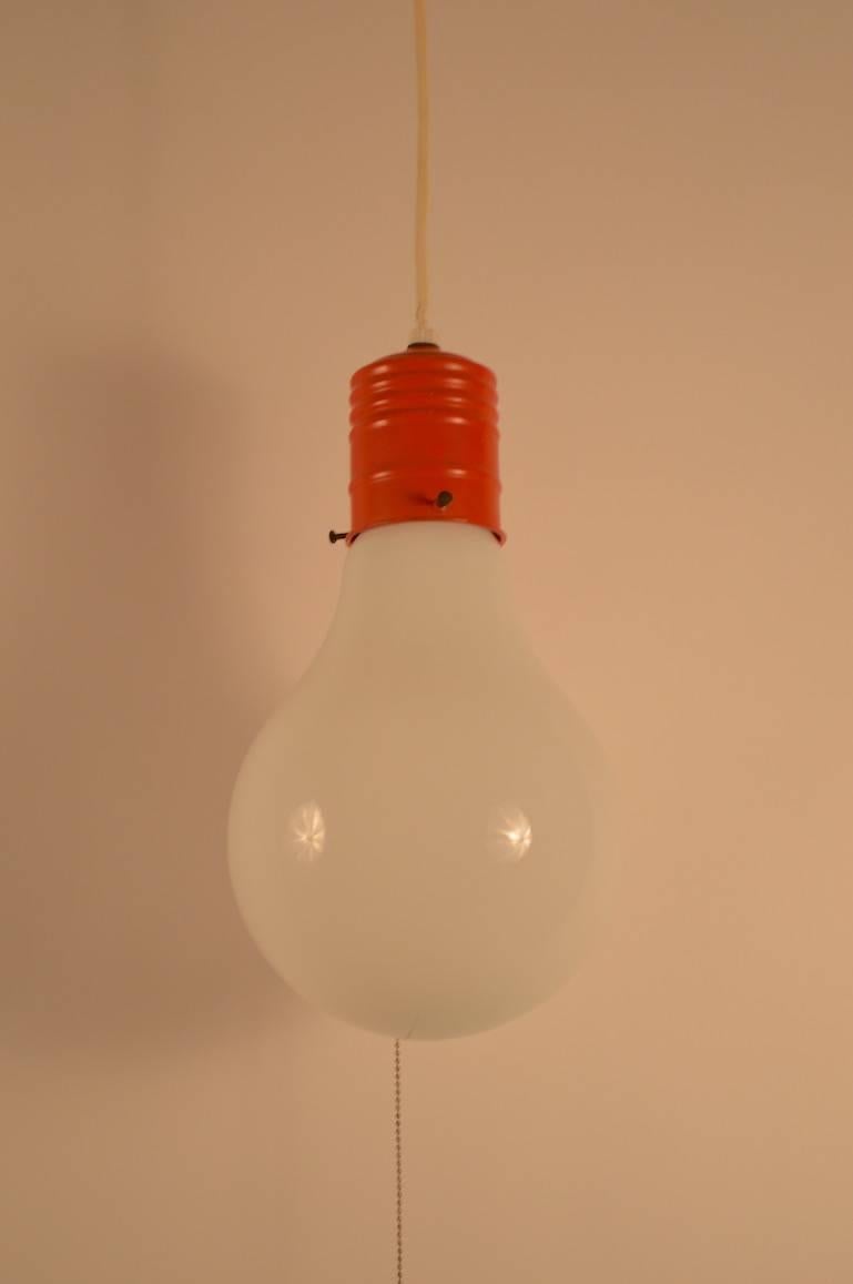 Hanging fixture in the form of a extra large light bulb. Probably American production after the archetypal Ingo Maurer designs of the period. Comes with long length of cord (185