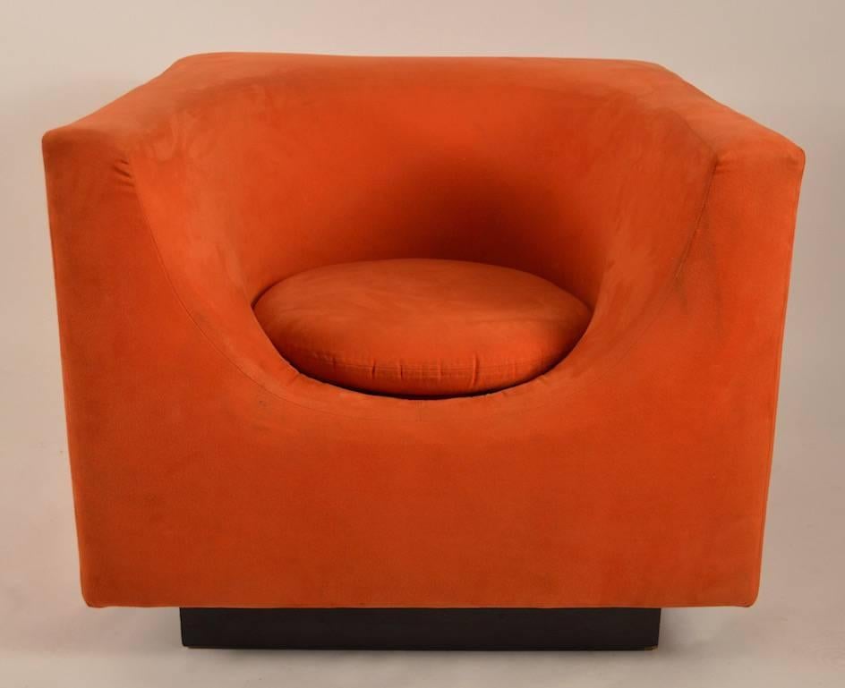 Very cool orange cube chair, upholstered in orange ultrasuede. Slight staining and wear to fabric, normal and consistent with age.