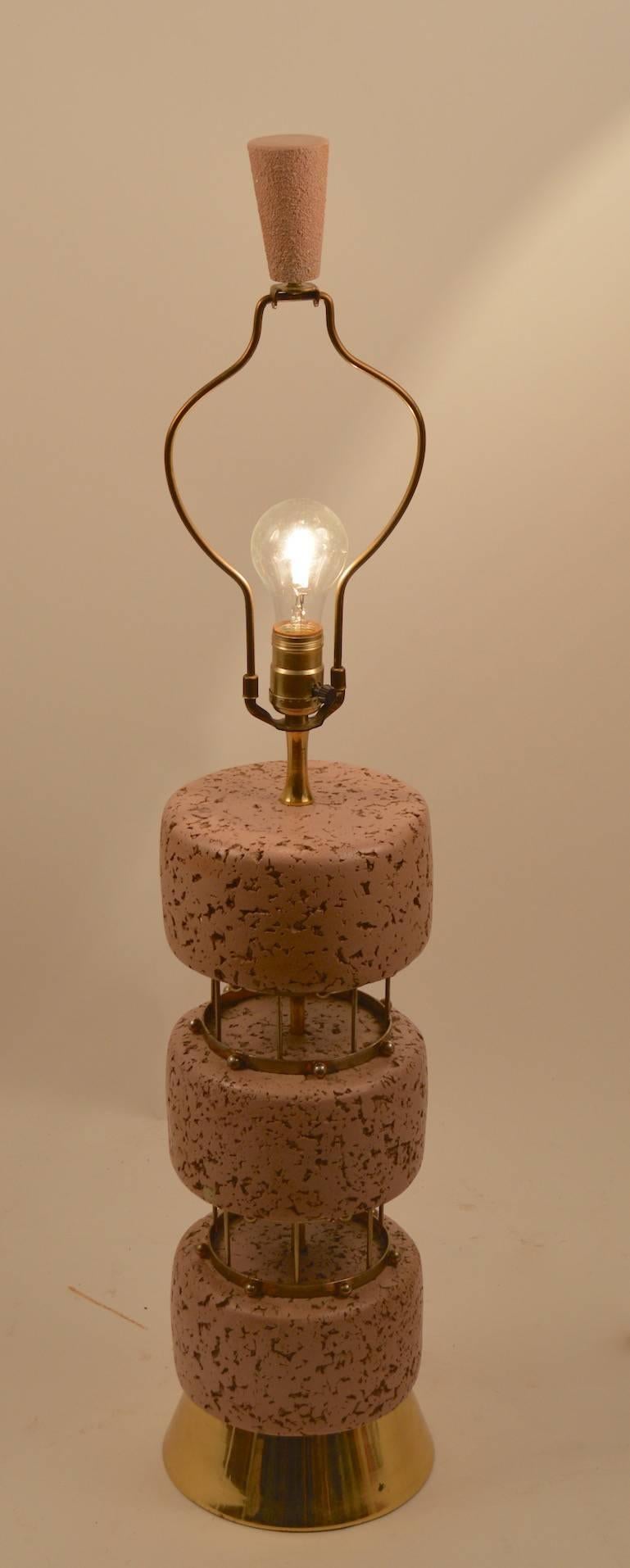 Plaster faux cork table lamps with brass colored metal spacer elements. Pair original, circa 1950s - working, clean, original condition, shades not included. Height to top of socket 24