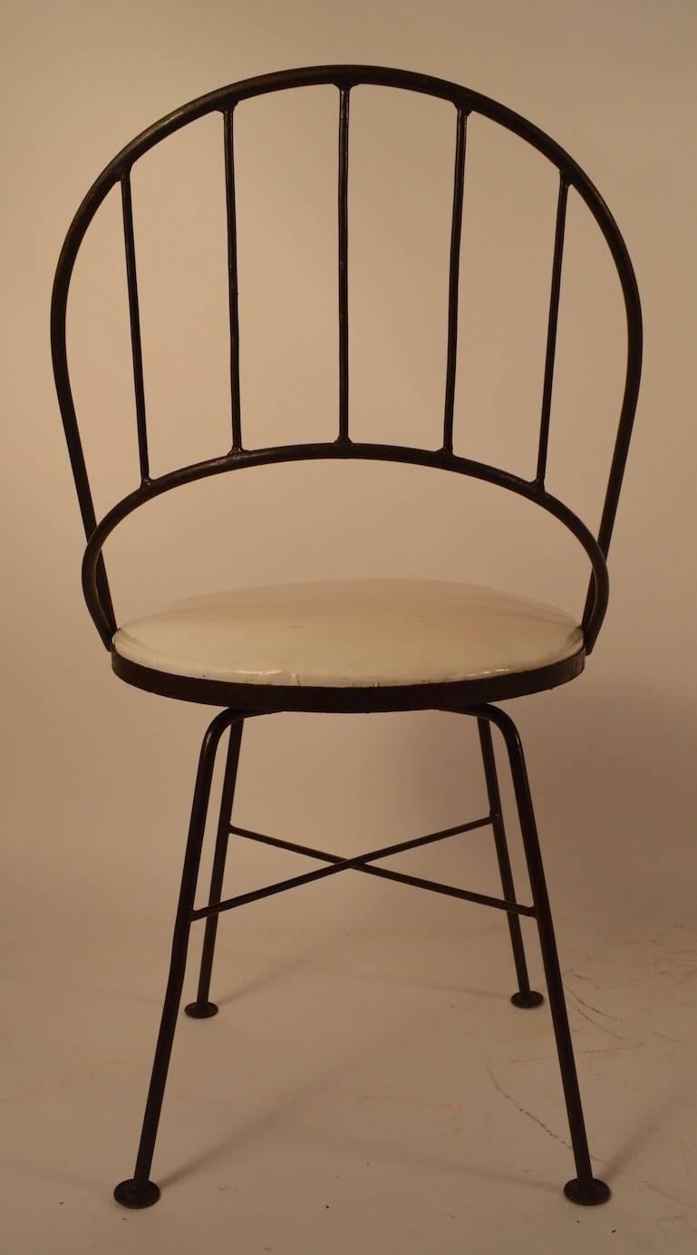 Mid-Century Modern Set of Four Wrought Iron Swivel Chairs For Sale