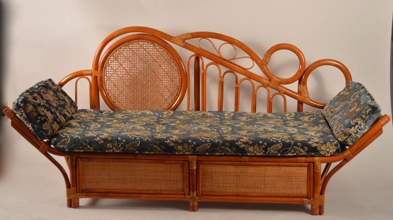 Extremely stylish bamboo daybed, chaise longue attributed to Tommi Parzinger for Willow Reed Furniture. The chaise comes with the cushion shown, however it is easy to reupholster to taste if you prefer. Great original condition, unusual form, chic