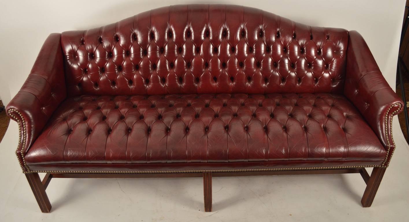 American Burgundy Leather Chippendale Camelback Sofa