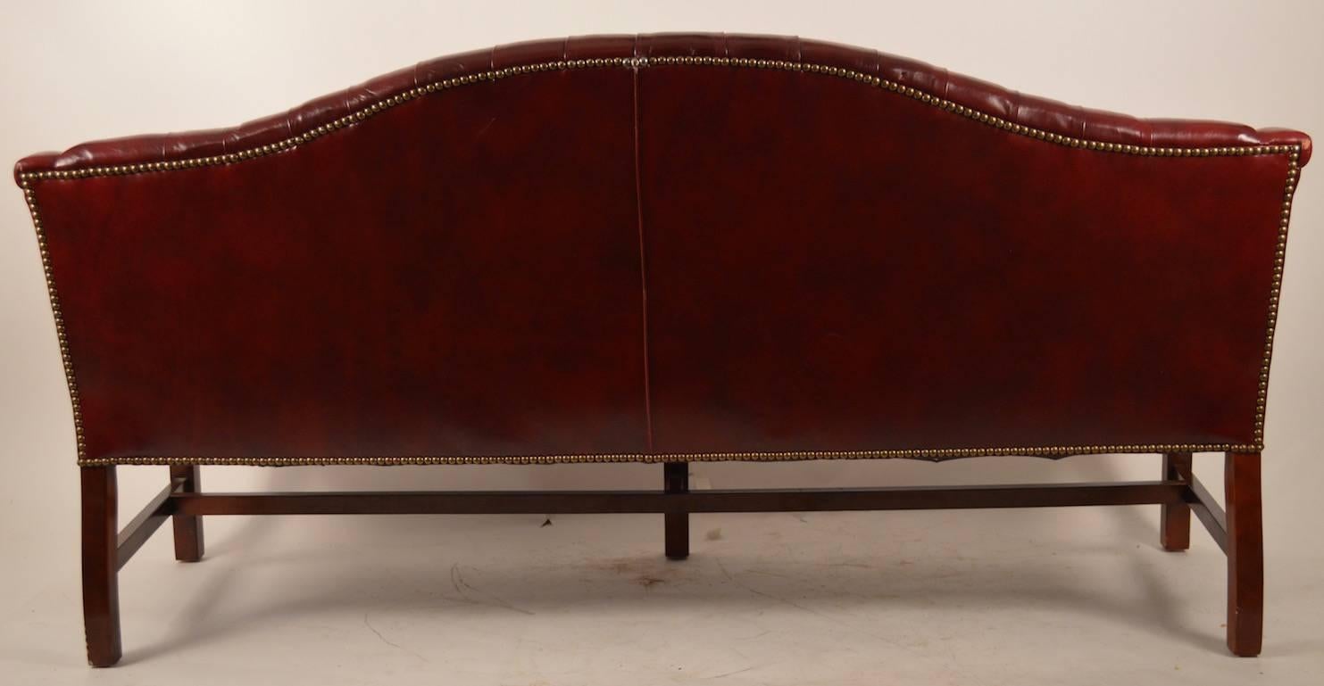 Burgundy Leather Chippendale Camelback Sofa In Excellent Condition In New York, NY