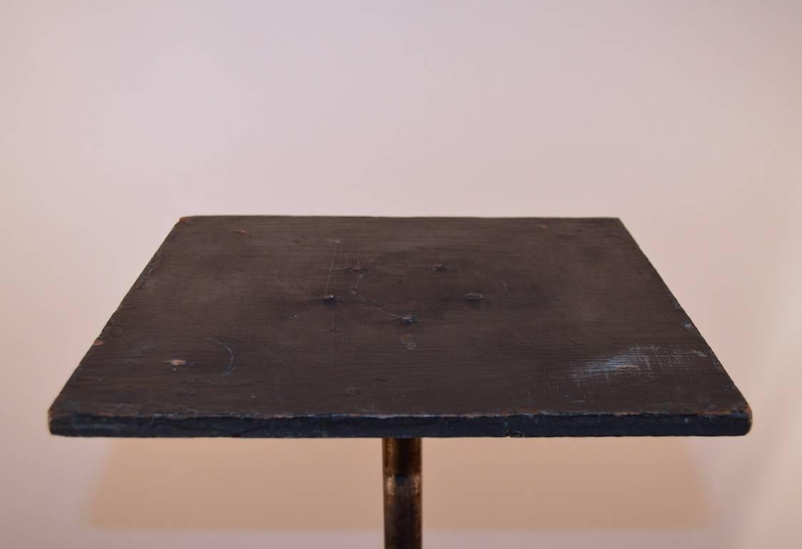 Three leg base of angle steel with adjustable center post, supports rectangular wood top (measures 12.5