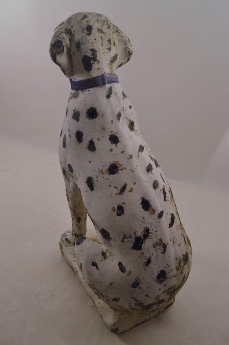Seated dog (Dalmatian) statuary with folky paint surface.
