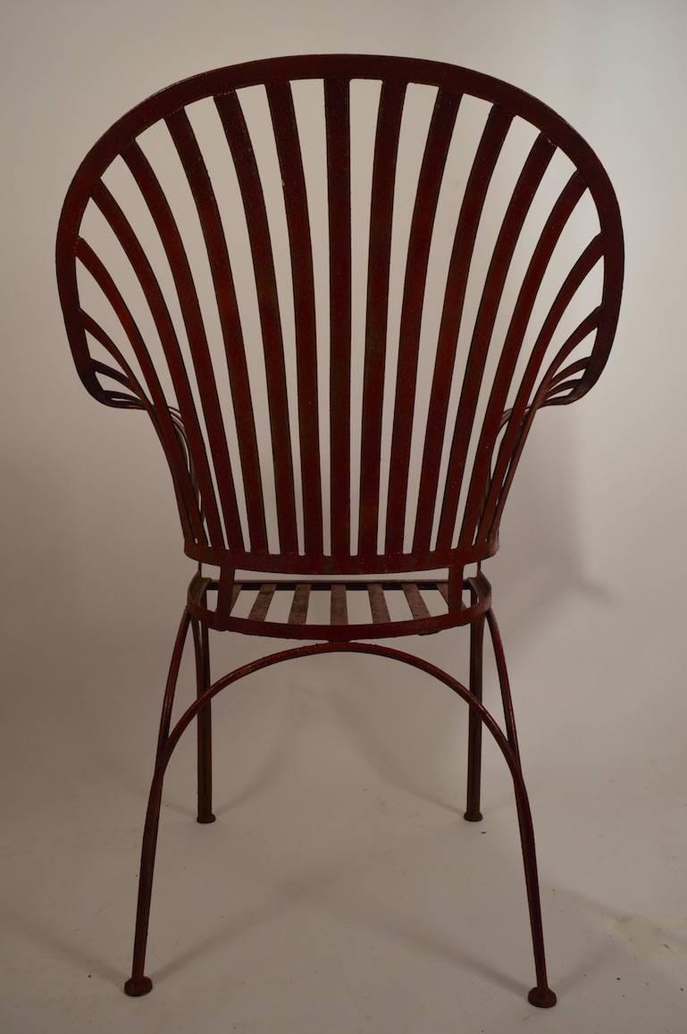 Large iron strap garden chair, probably by Woodard. Great form, and scale, very good condition, no breaks, welds or repairs, missing the seat cushion.