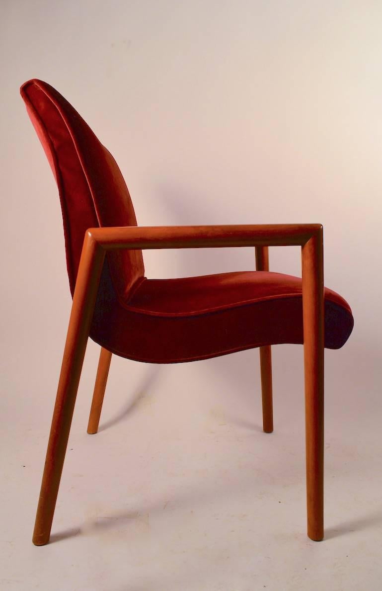 Elegant and sophisticated dining chair designed by Russel Wright for Conant Ball. Solid maple continuous arm leg configuration supports upholstered scoop form back and seat. Clean ready to use condition, comfortable and stylish. Set or four matching