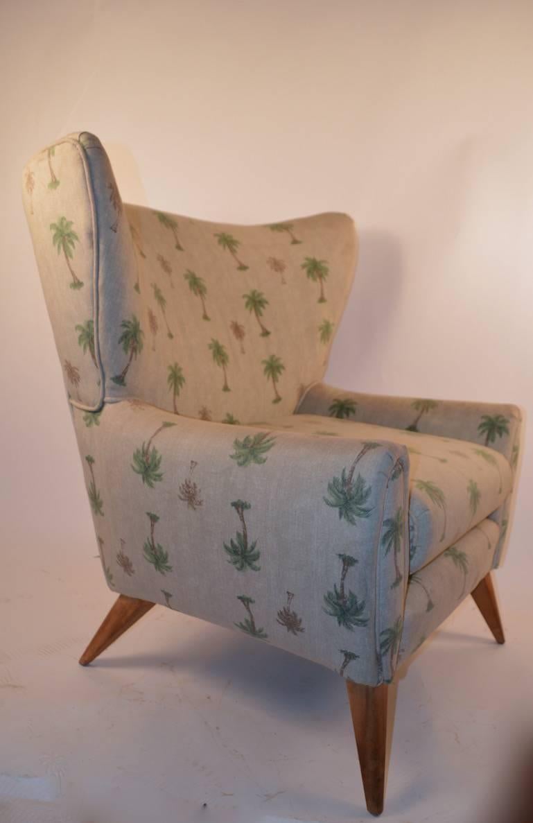 Stylish wingback lounge chair manufactured by Heywood Wakefield. Currently in worn 