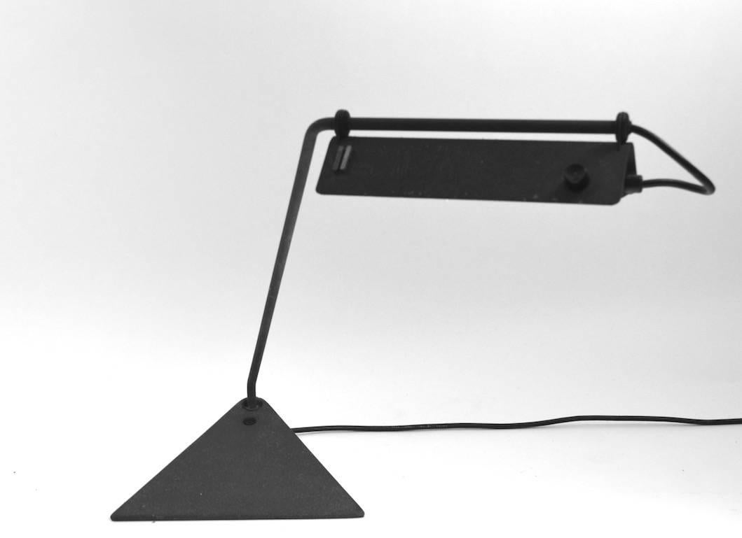 Matt finish metal adjustable desk lamp. The arm swivels and the hood shade
(9