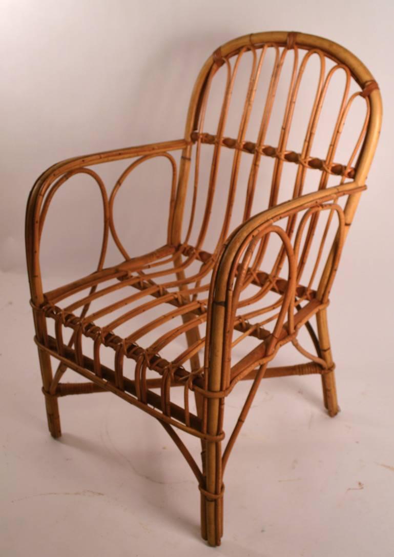 Nice pair of bamboo and reed armchairs. Both chairs are in very good, original vintage condition, ready to use. The chairs can be used with or without, the removable cushions. Selling and priced as a pair.