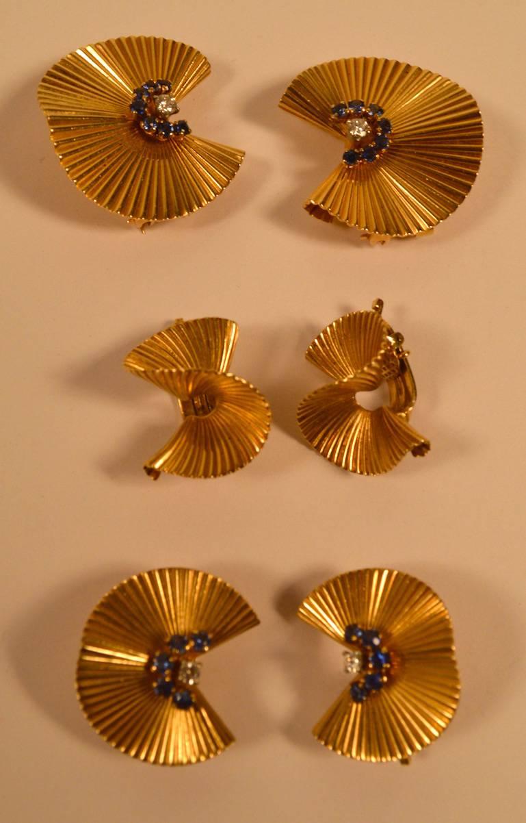 Matched set of tiffany pins (two) and earrings ( two pairs, four pcs ) six pieces total ion the lot. All are fully and correctly marked, all are 14-karat. The pins and larger earrings have sapphires and diamonds, the smaller earrings do not. Pins