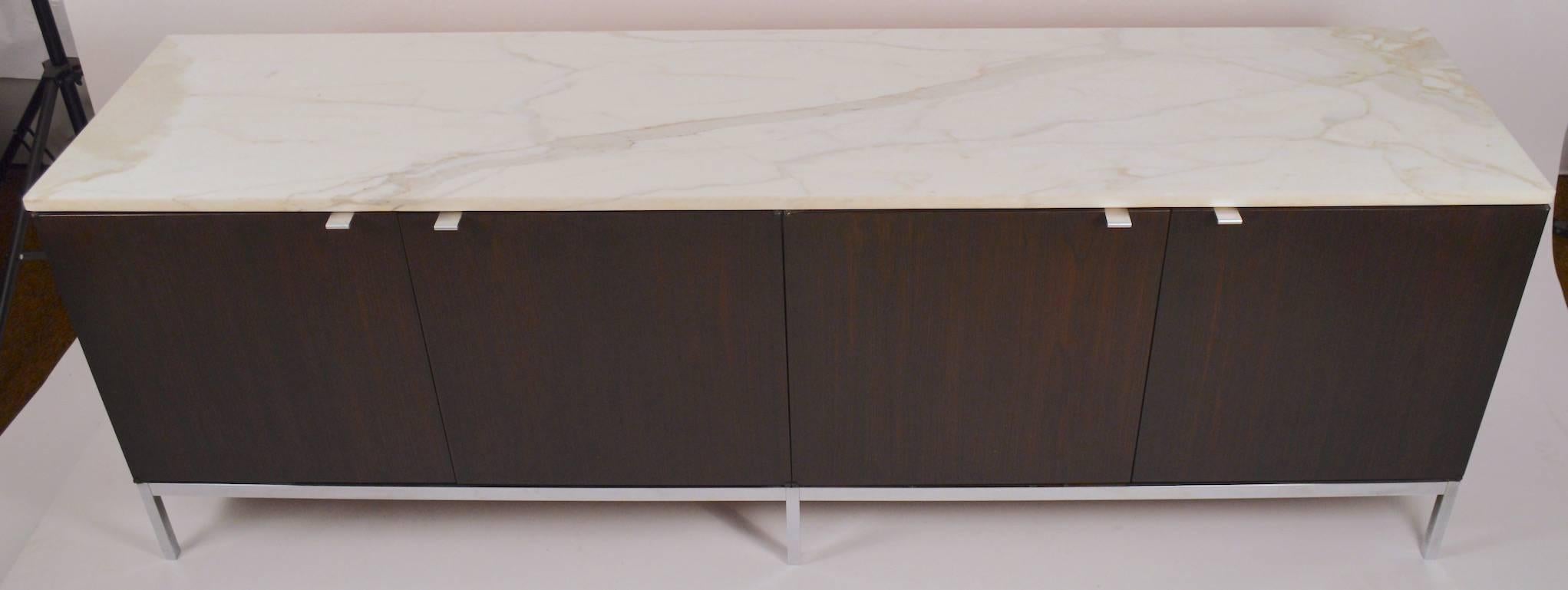 Dark wood case opens to reveal blonde interior, on chrome base with thick marble top (.75