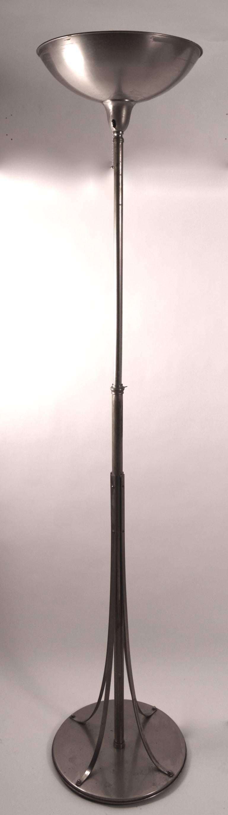 This Art Deco, Machine Age torchiere floor lamp was originally in the design office of the important and noted designer, artist Hugo Gnam, in fact he designed this lamp himself for his own personal use. The lamp is adjustable in height, highest 88