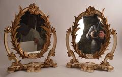 Two Venetian Parcel-Gilt Easel Mirrors