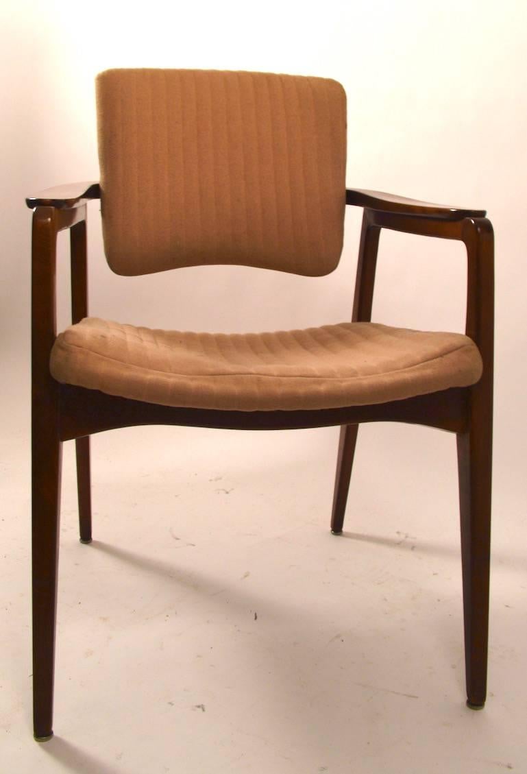 Pair Danish modern tilt back armchairs by Sigvard Bernadotte. These chairs are structurally sound, and sturdy, the upholstery is worn and will need to be replaced. Measures: Arm height 25