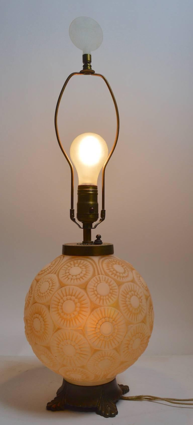 Ball form glass body lamp, probably by the Phoenix Glass Company, in the style of Lalique. The ball form body can be illuminated, and or the top bulb can be lit. Currently in in original wiring, and working, however the cord shows some wear.