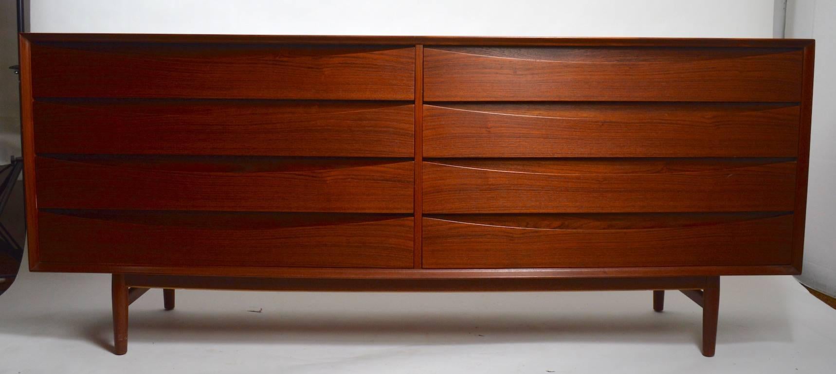 Nice teak Danish modern double dresser designed by Arne Vodder for Sibast. 
 This example is in very good, original condition, there is a very slight loss to one drawer front corner, and minor cosmetic wear, normal and consistent with age. Clean,