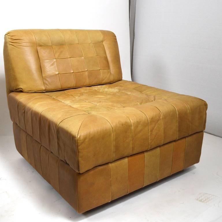Percival Lafer patchwork leather sofa, worn leather finish shows some stains and a couple of small tears, selling as is. This is a very cool, long, and rare sectional sofa. Six sections plus an extra, which can double as an ottoman. You can also