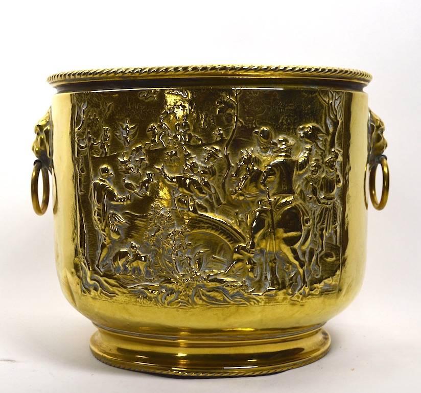 Interesting brass pail, or bucket, great for small firewood, planter, etc. Bucket shows village scene from 19th century life in repousse. Brass shows dovetail construction indicative of early craftsmanship.
 