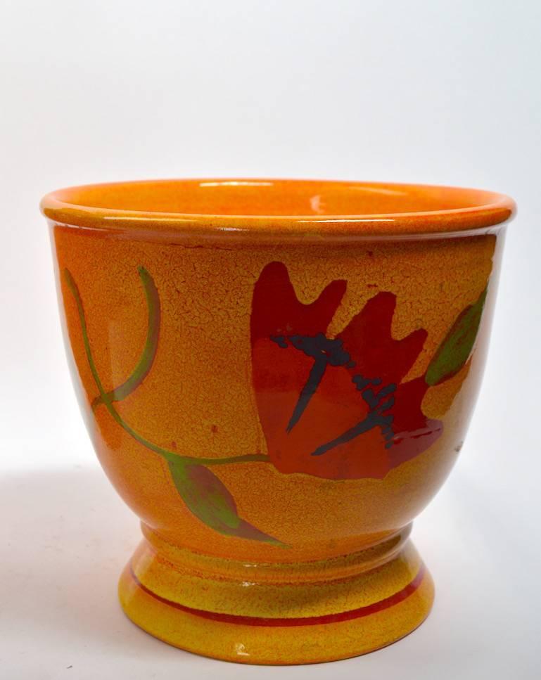 One Rosenthal netter vase, plus one flower pot form planter. Both have mustard yellow high glaze ground, with red or orange flowers in bloom. Both retain paper labels, and are in perfect condition. Dimensions of flower pot 10