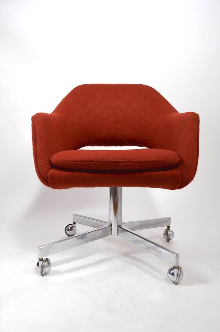 Great opportunity to purchase a large group of stylish Mid-Century swivel office chairs. The chairs are upholstered in commercial grade orange fabric, on chrome bases, with ball coaster feet. We are offering these chairs either as a lot or