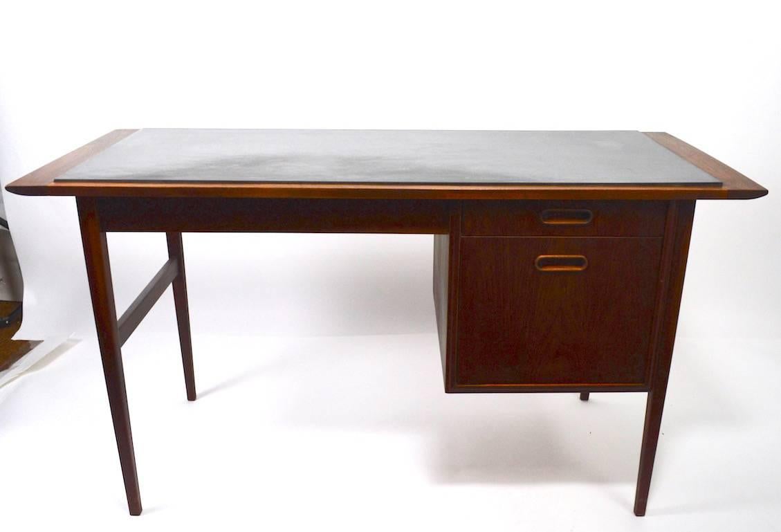 Interesting and functional Mid-Century Danish modern style desk. Walnut frame with 