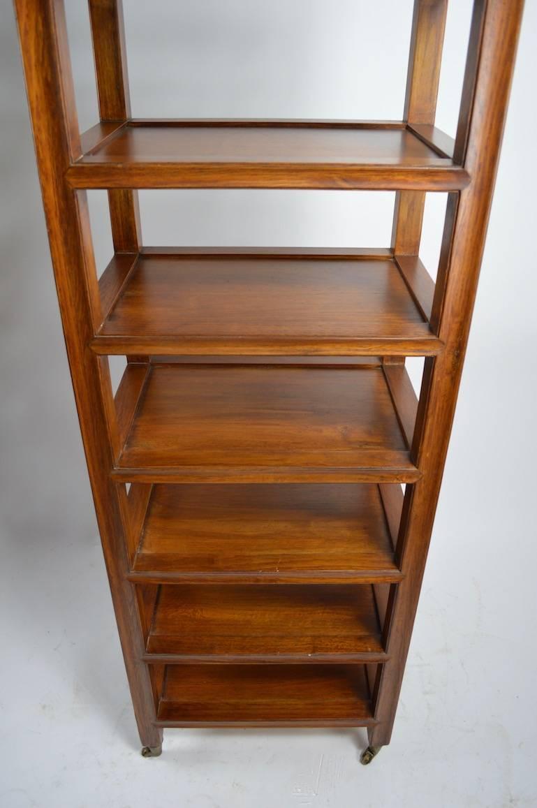 Solid Wood Etagere on Brass Wheel Coasters In Excellent Condition In New York, NY