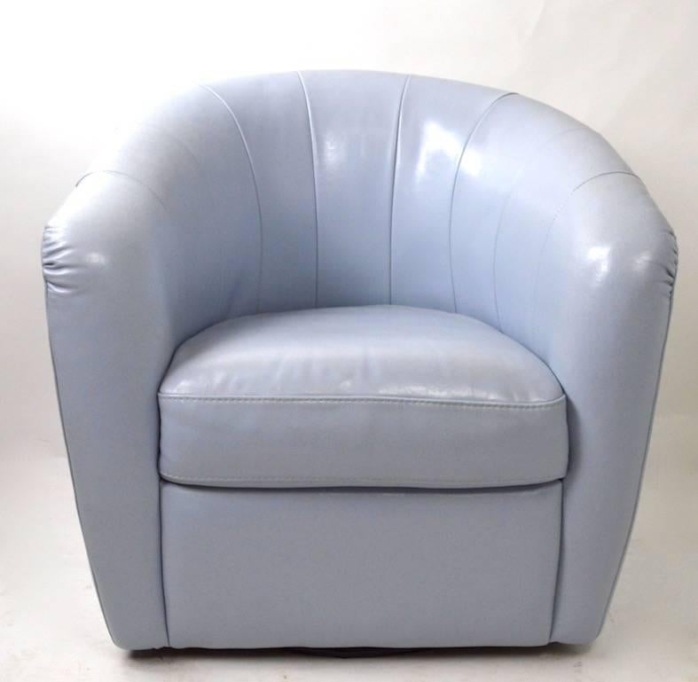 Pair of powder blue leather swivel chairs, original, clean and ready to use. One chair shows a very slight dimple mark on the back surface, as shown. This does not really detract as it does not go through the surface.
Stylish, and chic lounge