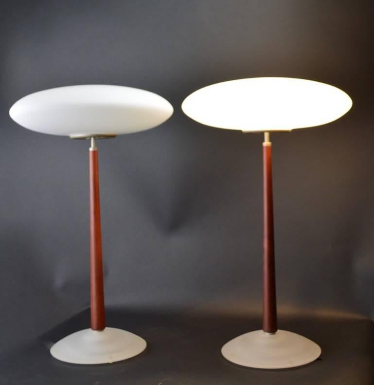 Wonderful pair of lamps designed by noted architect Matteo Thue for Arteluce. Both are in original, clean, working condition,. Selling and priced as a pair. 
 