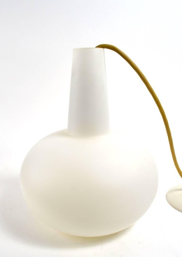 Satin White cased glass pendant light in teardrop form. We have one of these, red shades. We  have a total of eight  of these pendant lights in various colors, also listed separately. Please view our other listings if interested in multiples.
 Each