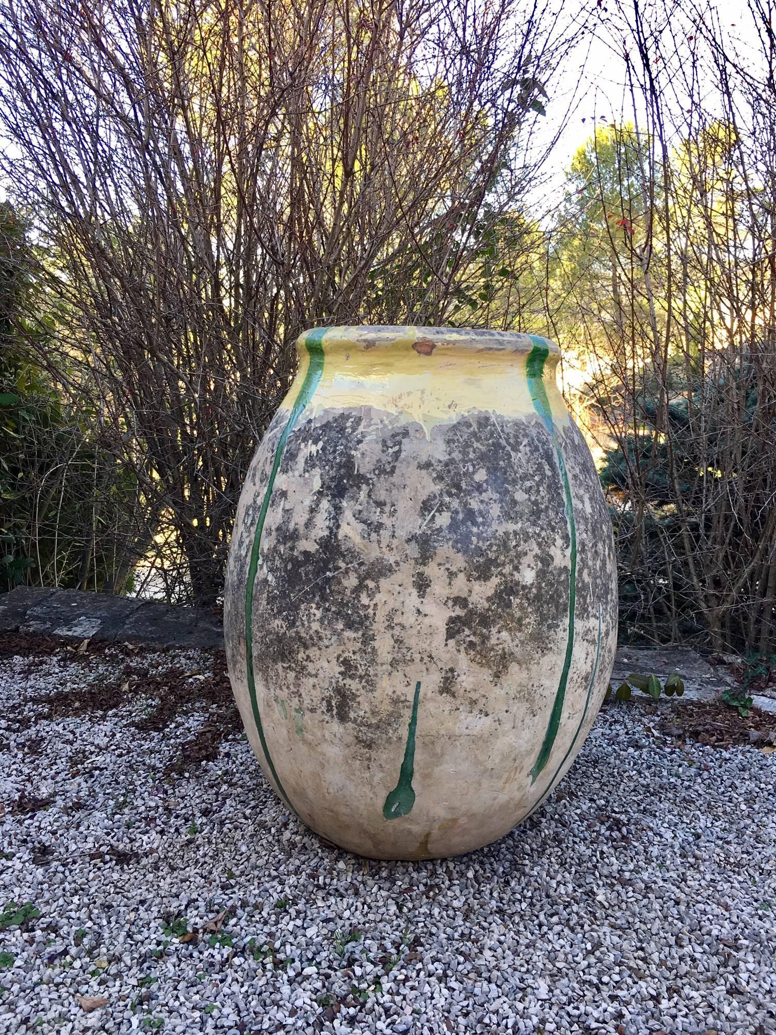 A large jar from Biot produced in the South of France, circa 19th century.
Terra cotta with a beautiful yellow and green glazed rim, original patina.
Originally used as storage containers for Olive.