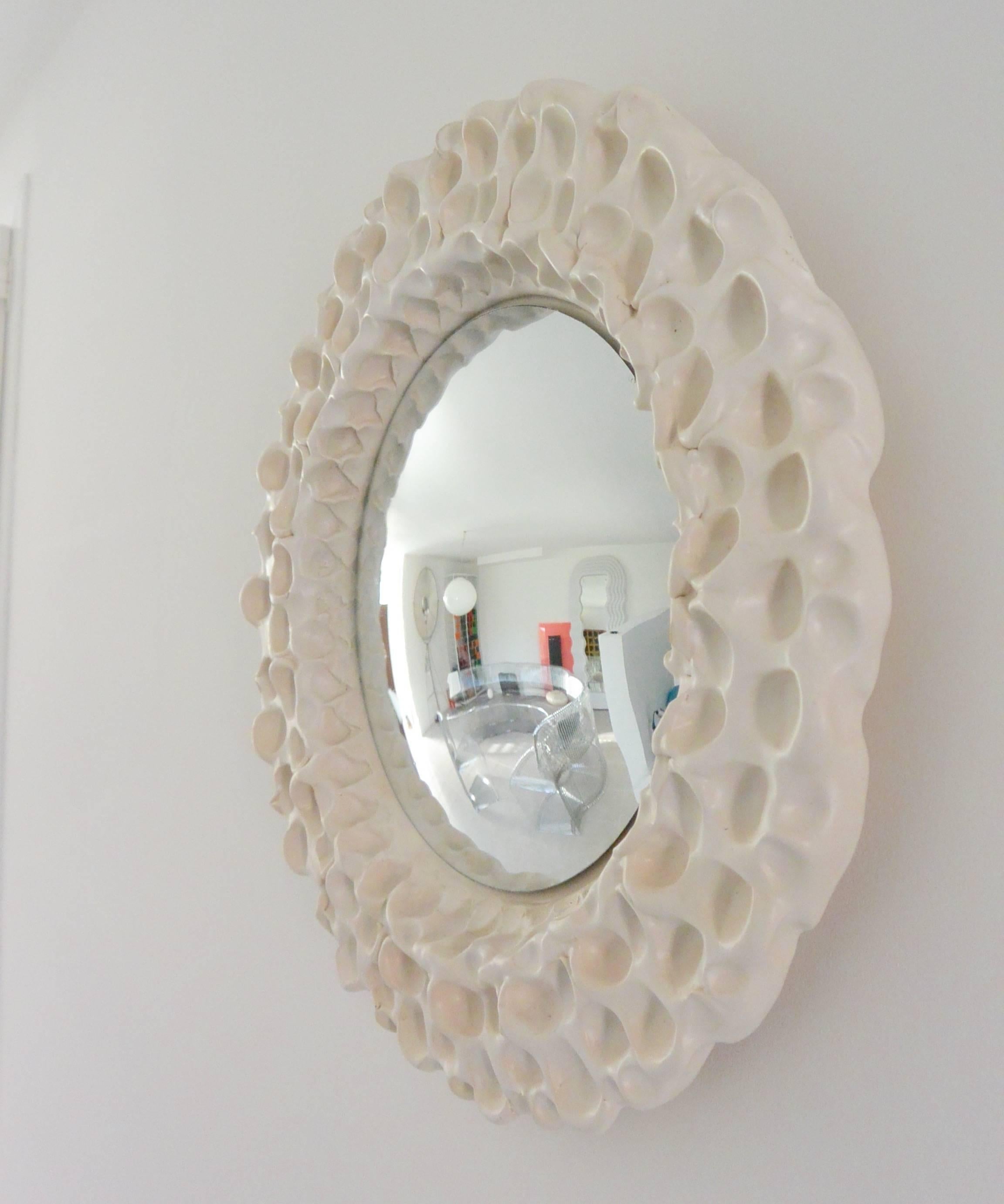 Beautiful convex mirror by the Atelier Buffile in white glazed ceramic,
circa 1980.

Measures: Diameter 43cm.
 