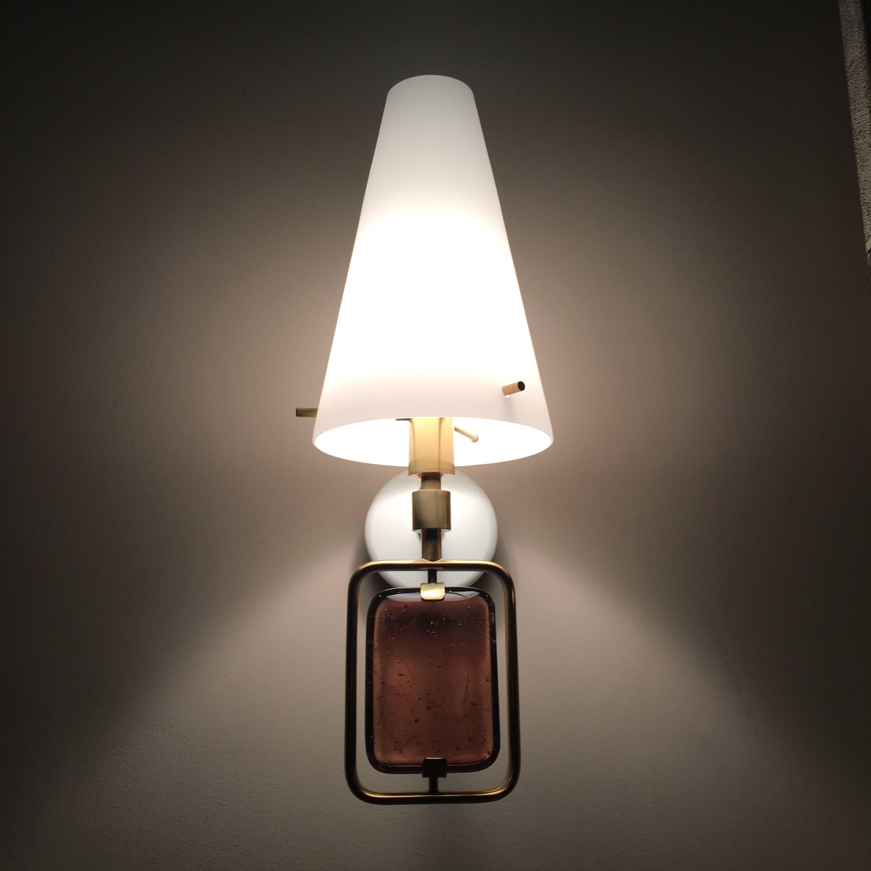 Unique and elegant pair of wall light by Roberto Giulio Rida.
Glass, brass, opaline shade; 
stamp of the artist in the brass.