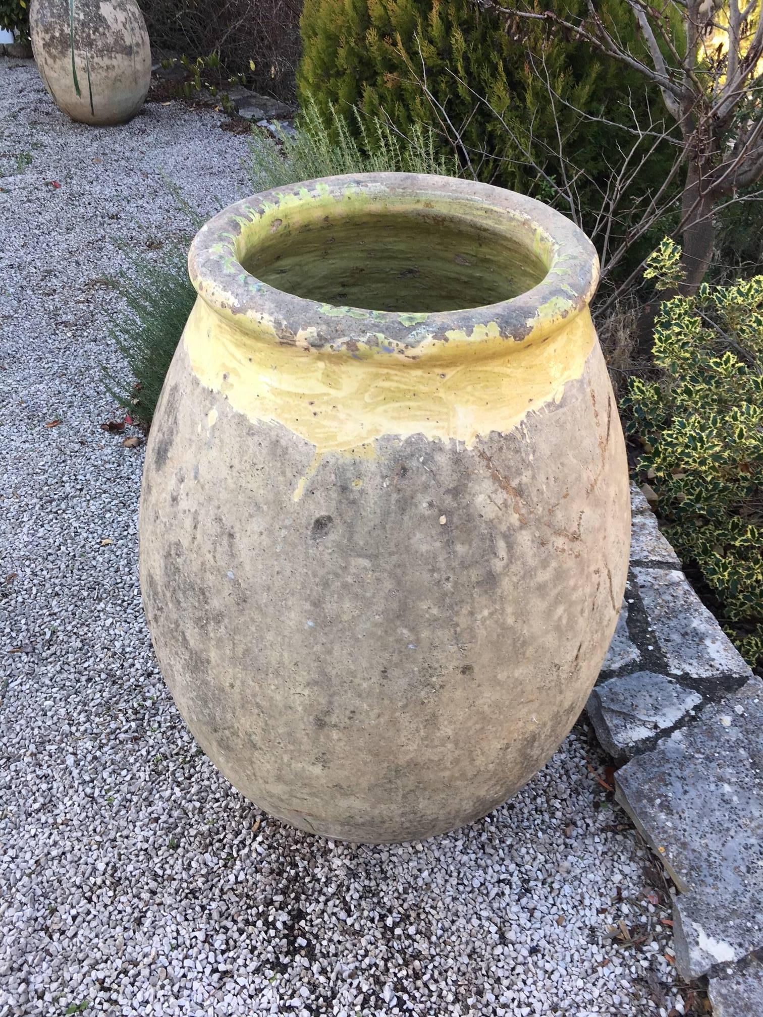 A large jar from Biot produced in the South of France, circa 19th century.
Terra cotta with yellow glazed rim, original patina.
Originally used as storage containers for olive.