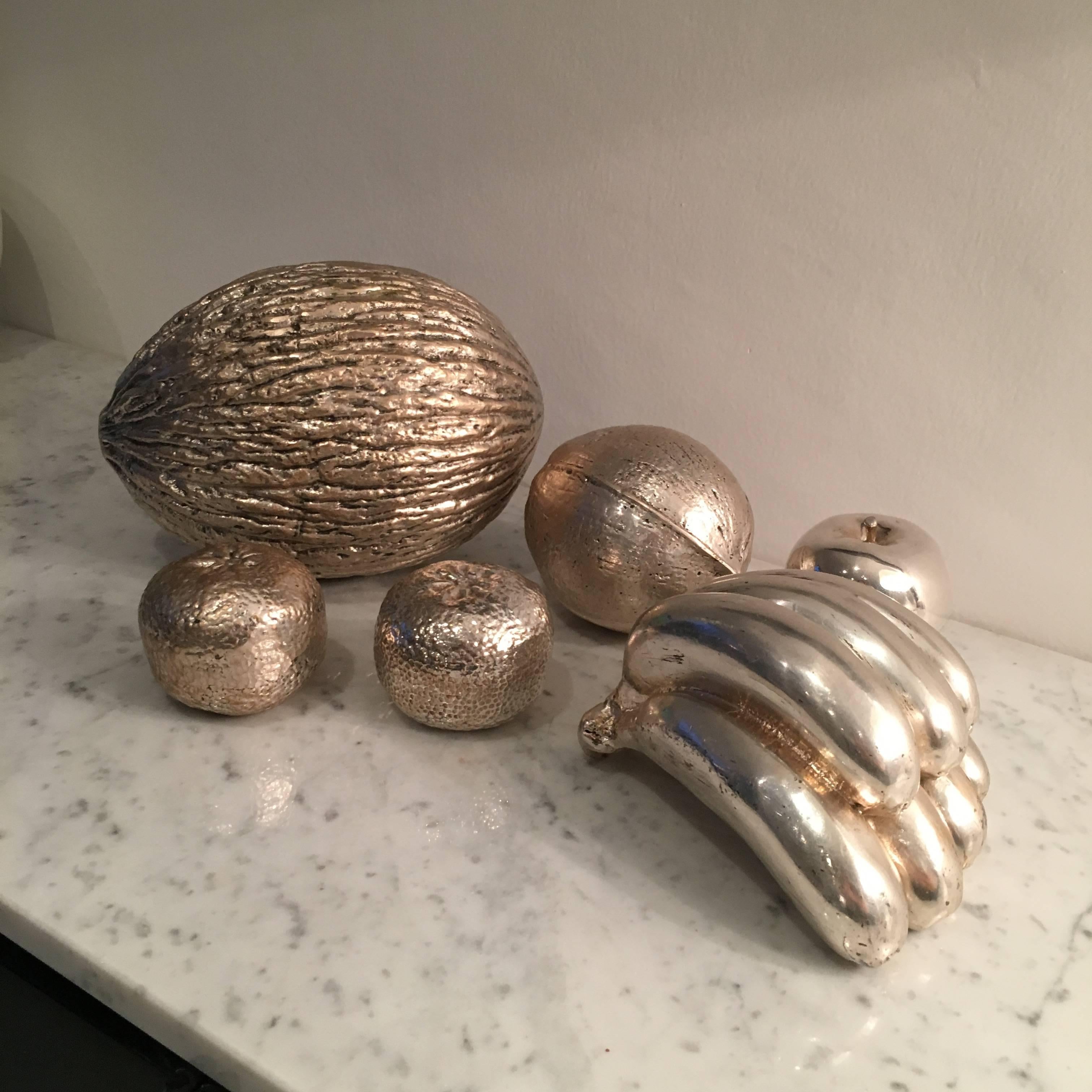 Beautiful and decorative set of stylized fruits in silvered metal.
Six Pieces, Italy, circa 1950.

Dimensions:
Orange Height 6.5cm X diameter 8cm
Coconut Height 14cm X diameter 11cm
Banana Height 10cm X length 17cm X depth 14cm
Yellow melon