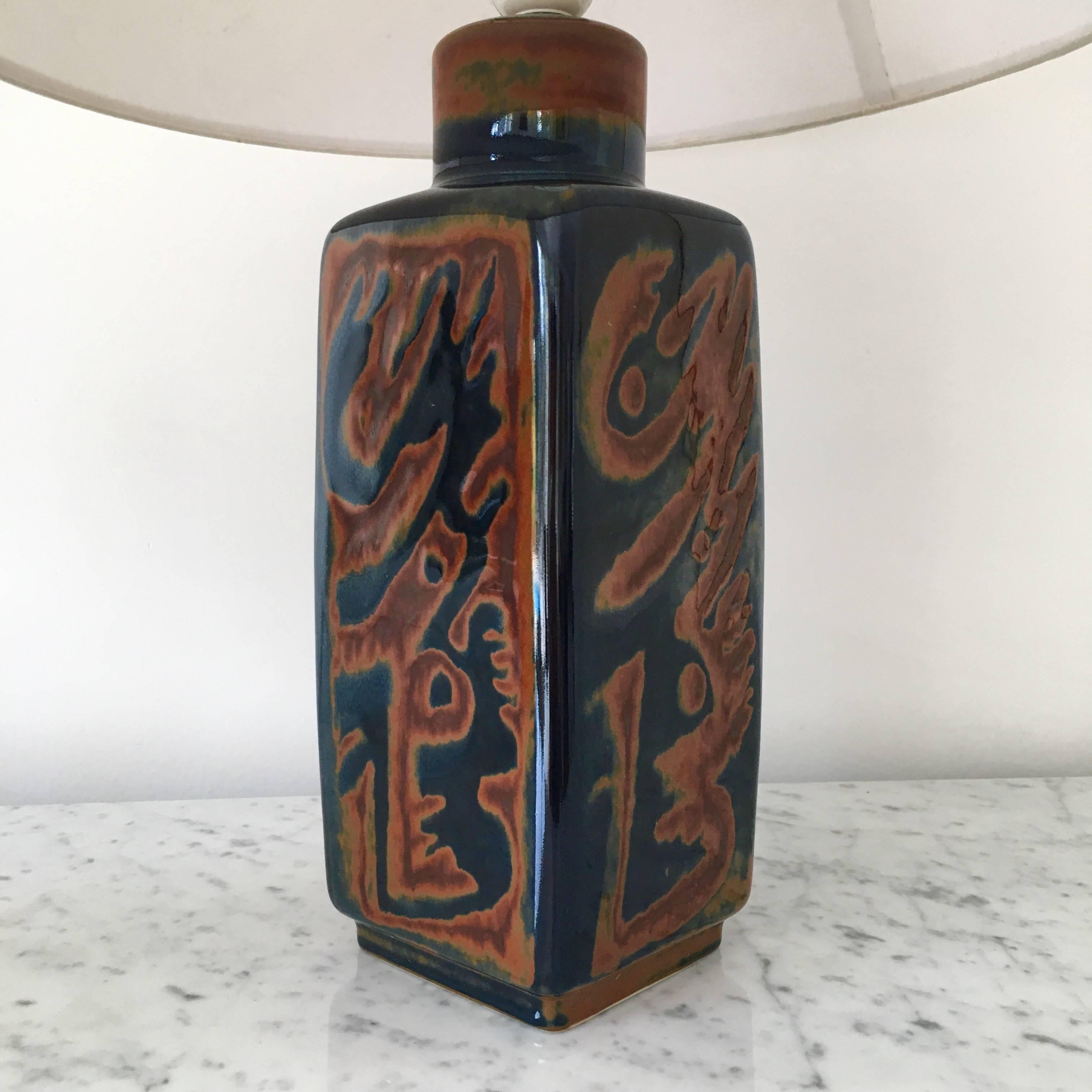 Rare and elegant pair of table lamps by Carl Harry Stalhane;
brown and blue glazed ceramic;
Manufactured by Rörstrand, Sweden, circa 1960.