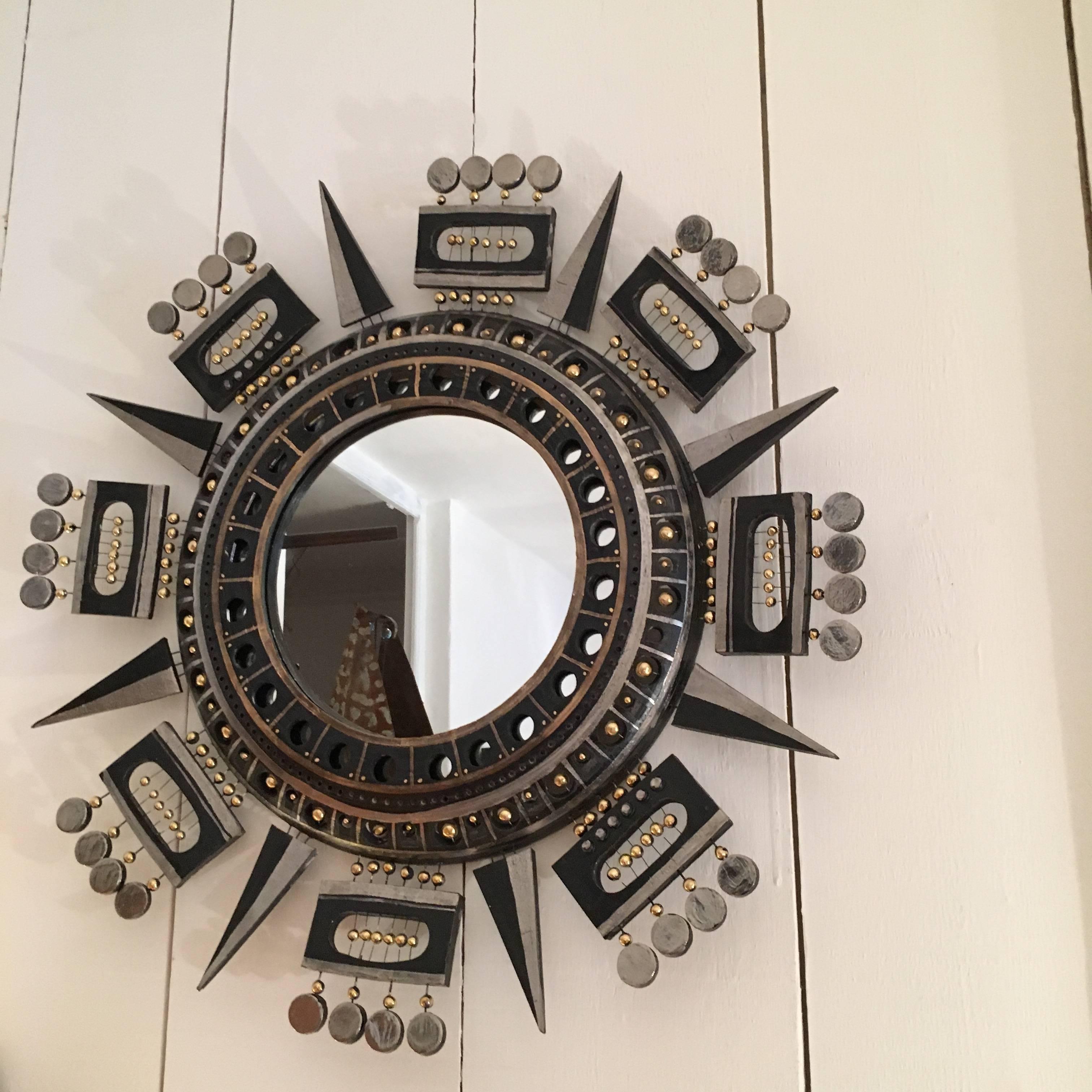 Beautiful mirror by Georges Pelletier;
Black and gold glazed ceramic.;
Signed on the back; 
France; circa 1970.