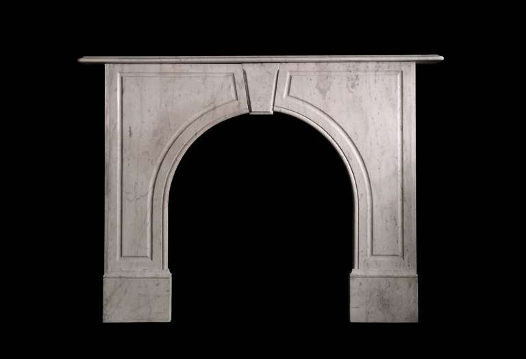 An early Victorian arched Carrara marble mantel in Carrara marble. Opening dimensions: 31