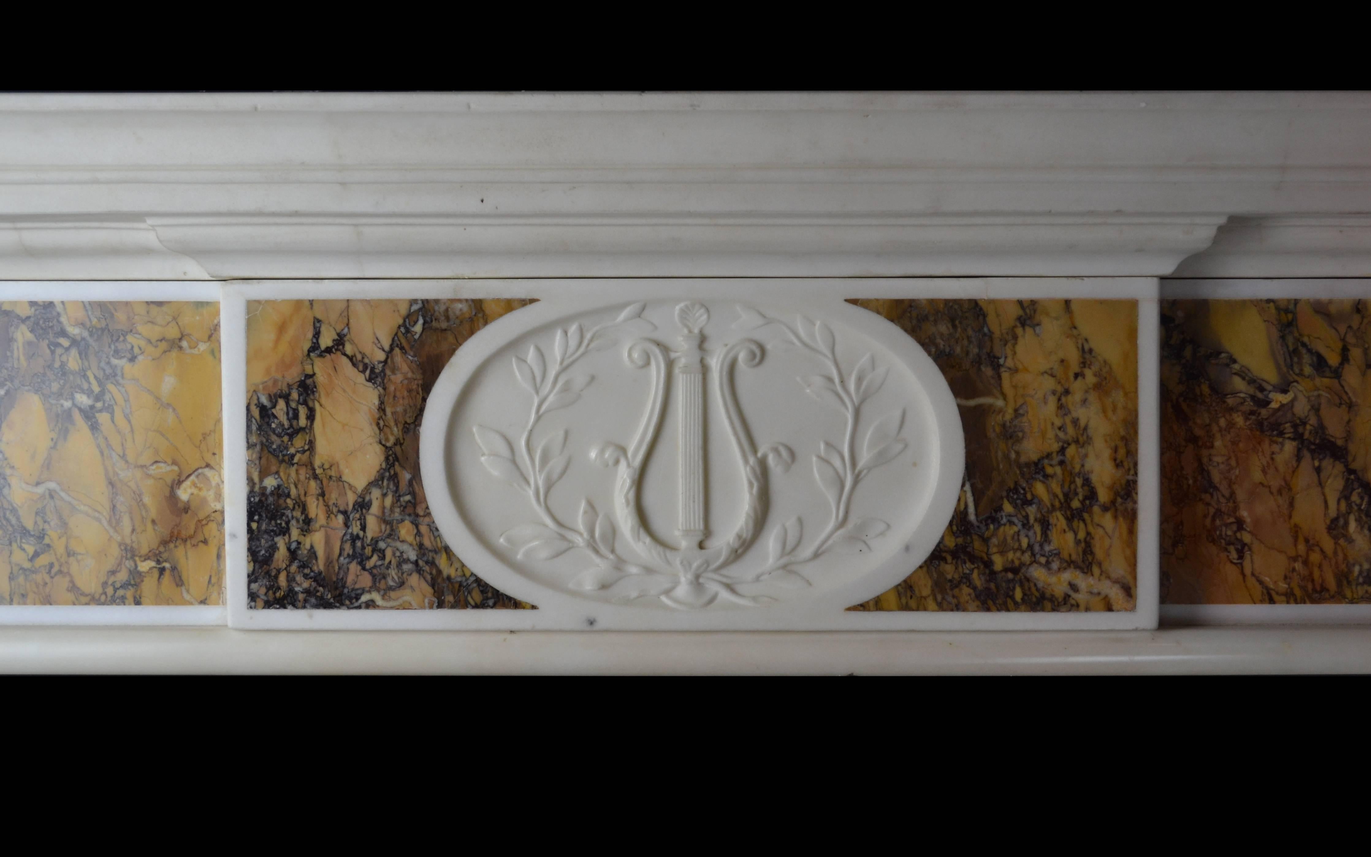 A “Dublin” chimneypiece, circa 1790 and typical of the style and composition of late 18th century chimneypieces widely found in Dublin. The chimneypiece has strongly figured and richly colored convent Siena panels to the pilasters and frieze panels,