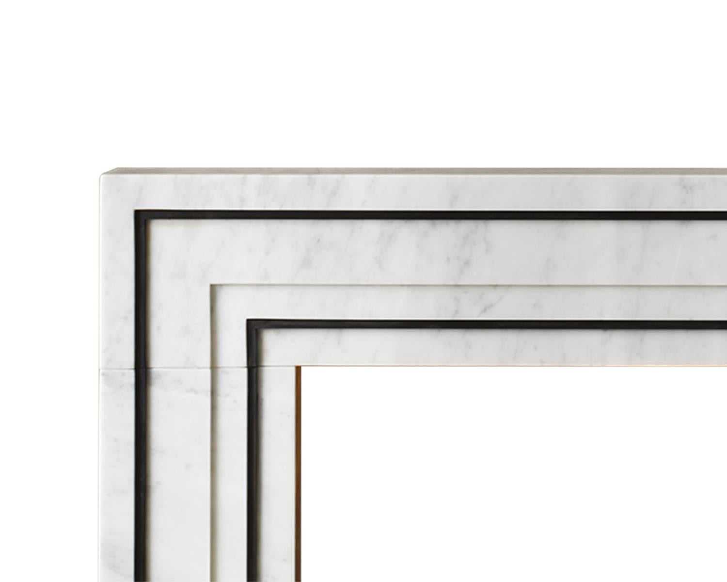 Designed by Eric Cohler for his contemporary collection for Chesney’s, the Ealing, was inspired by the Industrial revolution of the 19th century. 

This mantel is carved in Carrara marble with blackened steel accents.

Opening dimensions: 39