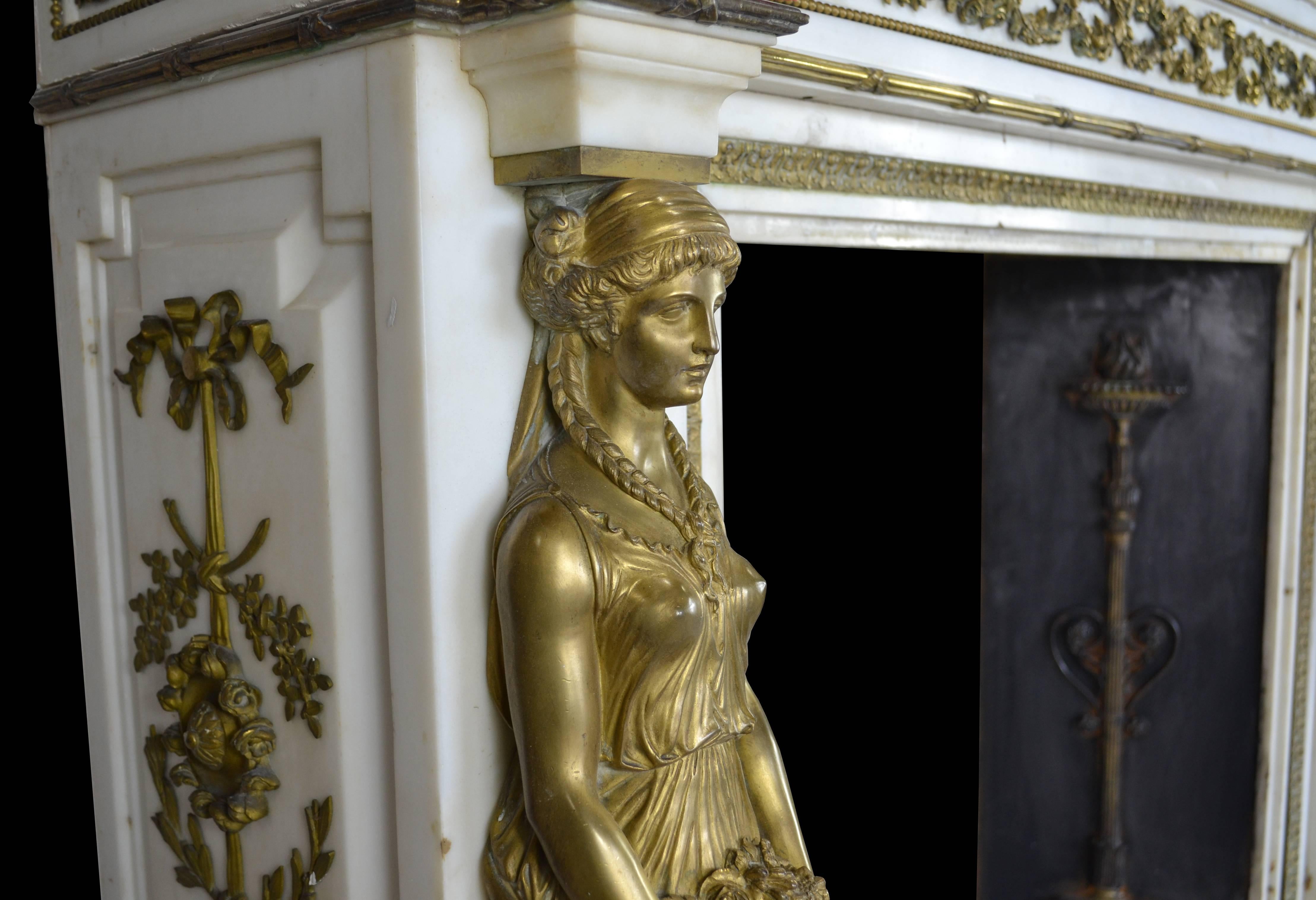 A 19th century Empire style French mantel of outstanding quality. In flawless Italian statuary marble with very fine ormolu decoration the mantel displays a wealth of decorative detail unique in a piece of such modest dimensions.

The jambs have