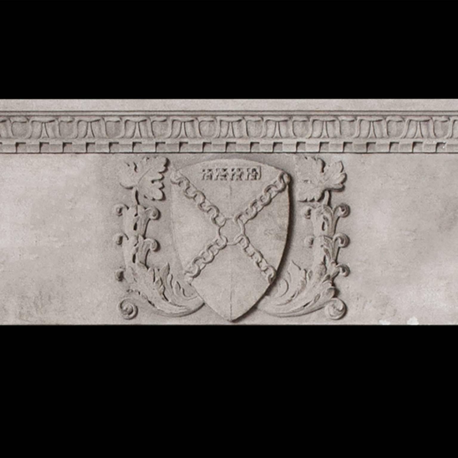 A large Gothic mantel hand-carved in sandstone with heraldic shield carving to the frieze supporting a shelf carved with lamb’s tongue and dentil detail.

Opening dimensions: 61