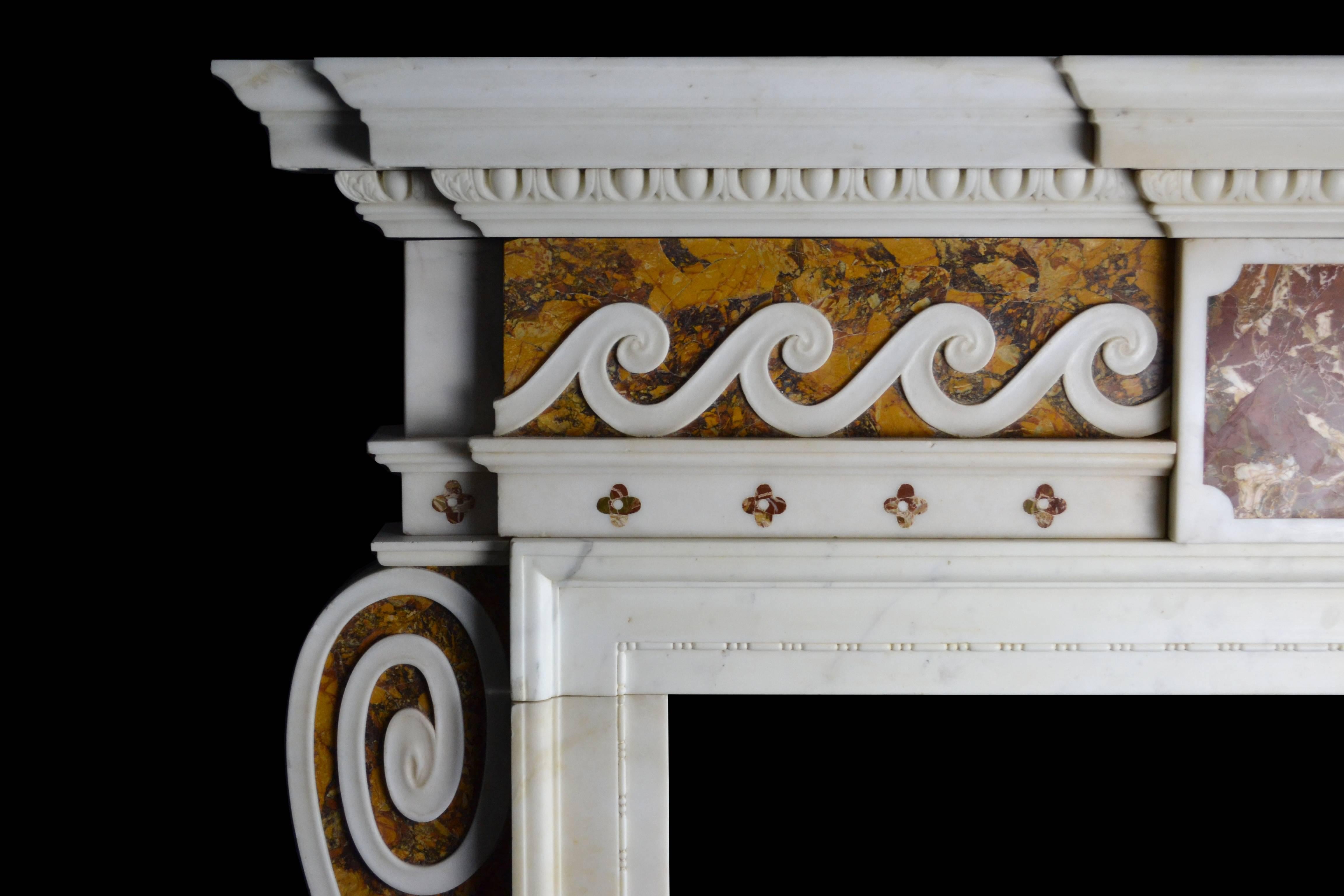 An important mid-18th century English mantelpiece of strong architectural form, with many hallmarks of the work of Sir Henry Cheere. In Statuary, Convent Siena and Sicilian Jasper marbles, with side facing consoles to the jambs, abutting inground
